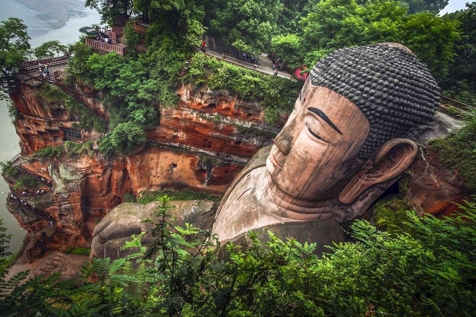 The world's largest Buddha statue carved into a rock mountain 0